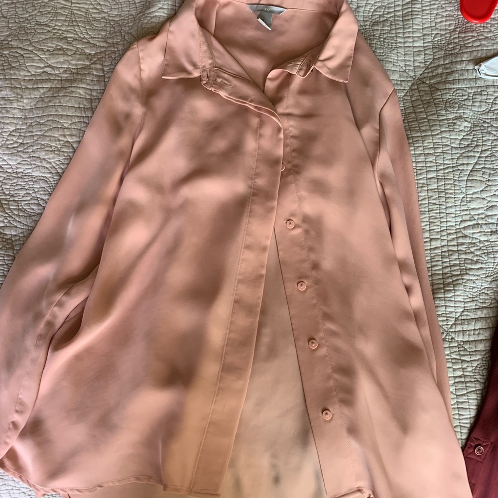 Blush-colored button-up blouse